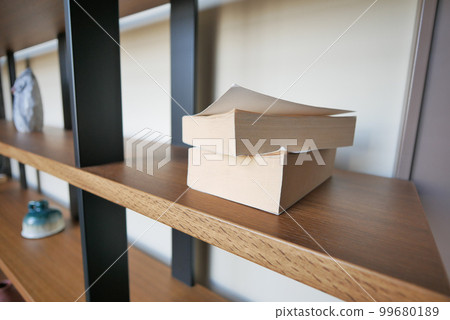 stack of books on wooden table stack of books on wooden table 99680189