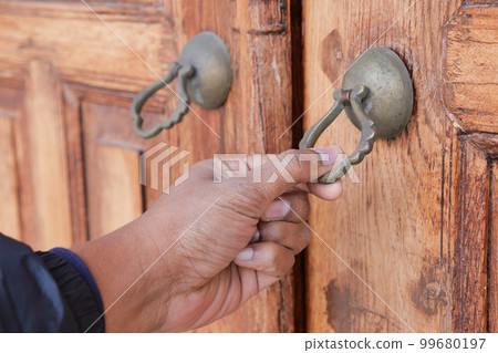 young man hand knocking door, 99680197