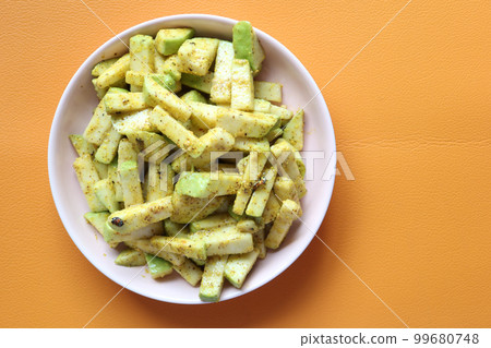 close up of slice of guava on table  99680748