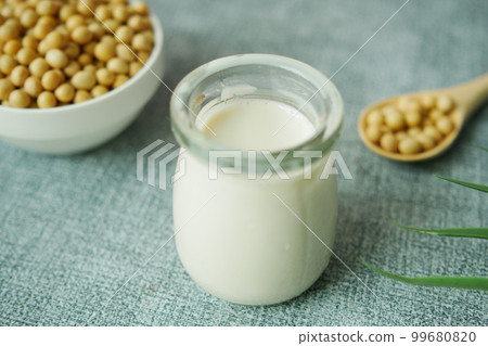slow motion of soy milk pouring in a glass jar  99680820