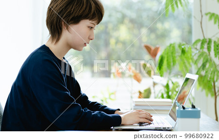 Young woman working from home 99680922