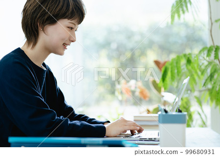 Young woman working from home 99680931