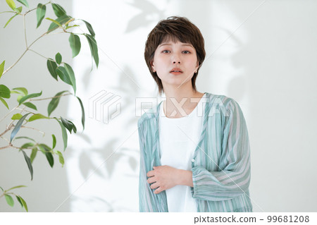 Portrait of a young woman worried about UV rays 99681208