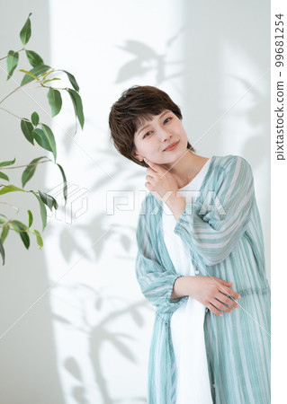 Portrait of a young woman worried about UV rays 99681254