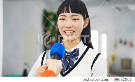 female student being interviewed 99682061
