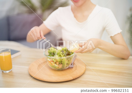 Asian woman dieting Weight loss eating fresh fresh homemade salad healthy eating concept 99682151