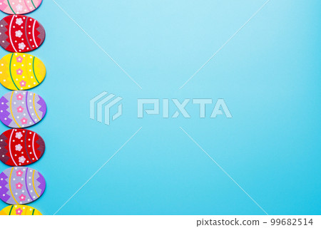 Easter Eggs. Colorful Easter eggs on blue background with copy space 99682514