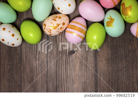 Easter eggs on wooden background. Colorful Easter eggs on a wooden background 99682519