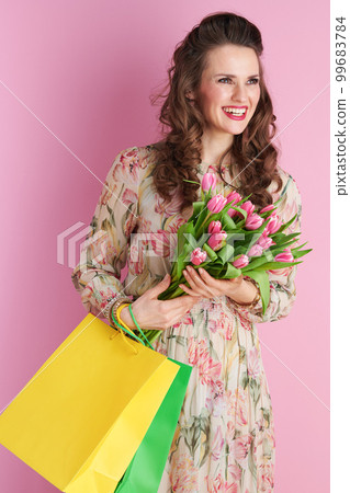 happy stylish woman with long wavy brunette hair on pink happy stylish woman with long wavy brunette hair on pink 99683784