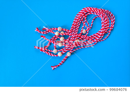 Bulgarian symbol of spring martenitsa on blue 99684076