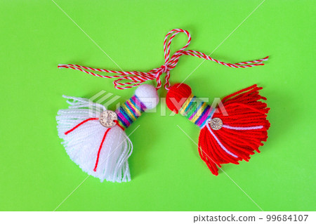 Bulgarian symbol of spring martenitsa on green 99684107