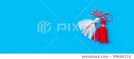 Bulgarian symbol of spring martenitsa on blue, banner 99684118