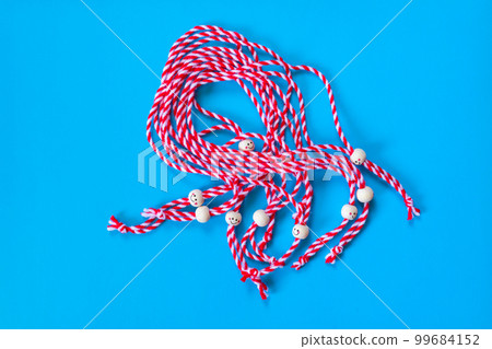 Bulgarian symbol of spring martenitsa on blue 99684152