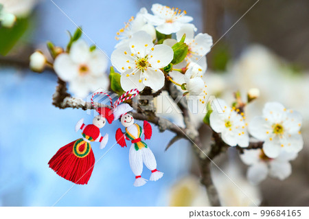 Bulgarian Martenitsa on blossoming tree branch 99684165