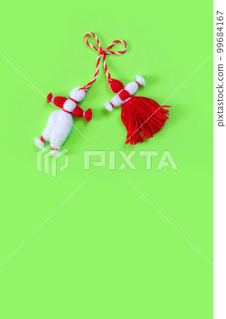 Bulgarian symbol of spring martenitsa on green 99684167