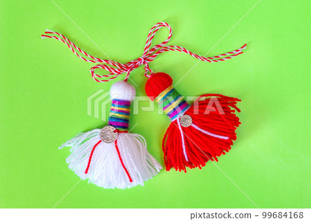 Bulgarian symbol of spring martenitsa on green 99684168