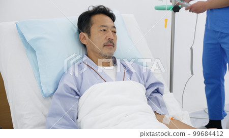 Man sleeping on an electric reclining bed Man sleeping on an electric reclining bed 99684412