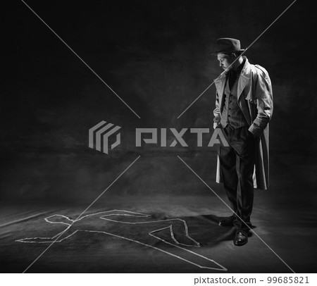 Black and white, noir photography. Man, detective in hat and trench coat looking on human drawn silhouette on floor. Murder investigation Black and white, noir photography. Man, detective in hat and trench coat looking on human drawn silhouette on floor. Murder investigation 99685821