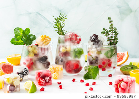 Refreshing drinks with ice cubes with fruits Refreshing drinks with ice cubes with fruits 99685987