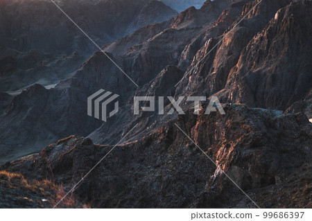 Mystical rocky background at sunrise light like mars surface. Ili gorge in Almaty region, Kazakhstan nature 99686397