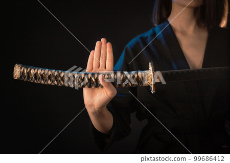 Ninja samurai holds katana in a hands Stock Photo