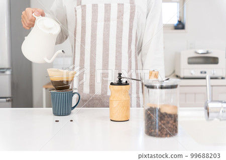 A man in his 40s drinking coffee A man in his 40s drinking coffee 99688203