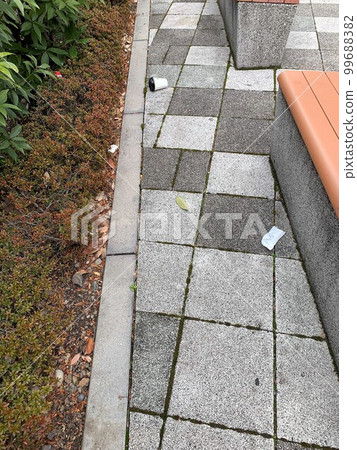 Littering garbage in front of the station 99688382