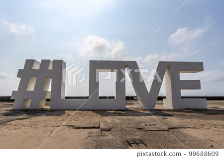 Public art, #love, at Mattou seaside park, Japan. 99688609