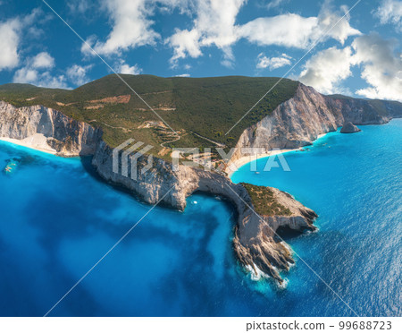 Aerial view of blue sea, mountains, sandy beach at sunny day Aerial view of blue sea, mountains, sandy beach at sunny day 99688723