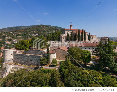 Panoramic drone view of the western part of the historic castle on a hill in the city of Brescia 99689244