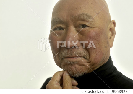 A smiling Japanese senior with a beard 99689281