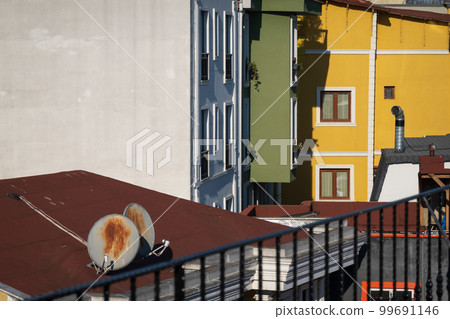 Colorful buildings and roofs on street Colorful buildings and roofs on street 99691146