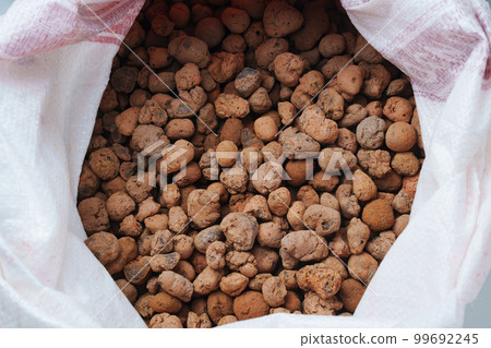 Expanded clay in a bag. lumps of clay used in construction and growing plants. Expanded clay in a bag. lumps of clay used in construction and growing plants. 99692245