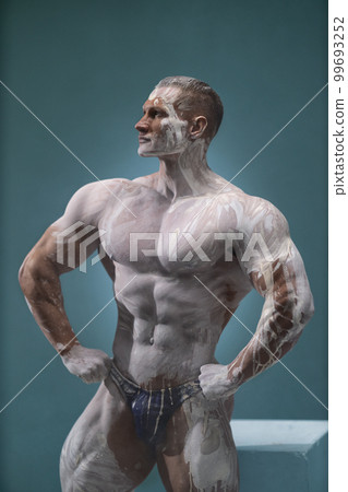 Studio portrait of sexy male model body, nude torso 99693252