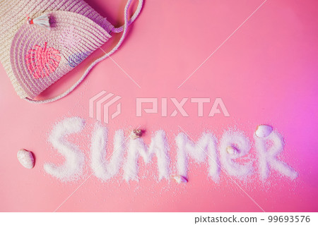Summer text made of sand on pink background, copy space Summer text made of sand on pink background, copy space 99693576