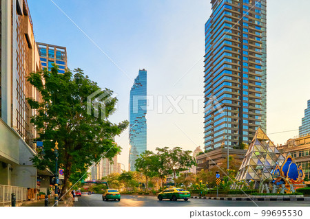 Street in Bangkok, Thailand, high-rises, trees, sunlight, evening. Street in Bangkok, Thailand, high-rises, trees, sunlight, evening. 99695530