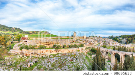 Breathtaking view on Gravina in Puglia ancient town, bridge and canyon at sunris 99695633