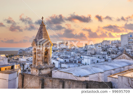 Amazing view of old white town Ostuni and cathedral at sunrise. 99695709