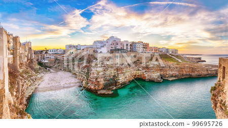 Stunning sunset at Cala Paura gulf with Bastione di Santo Stefano and Lama Monachile beach in background. Stunning sunset at Cala Paura gulf with Bastione di Santo Stefano and Lama Monachile beach in background. 99695726