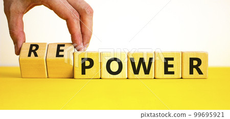 Power or repower symbol. Businessman turns wooden cubes and changes concept words Power to Repower. Beautiful yellow table white background. Business ecological power or repower concept. Copy space. Power or repower symbol. Businessman turns wooden cubes and changes concept words Power to Repower. Beautiful yellow table white background. Business ecological power or repower concept. Copy space. 99695921