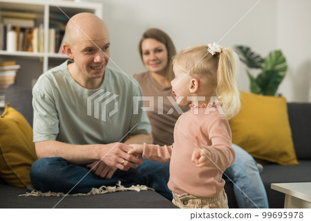 Cochlear implant system. Installation cochlear implant on child girl ear for restores hearing. Kid hears after hear return to normal 99695978