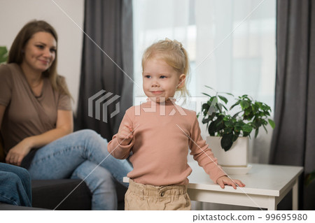 Cochlear implant system. Installation cochlear implant on child girl ear for restores hearing. Kid hears after hear return to normal Cochlear implant system. Installation cochlear implant on child girl ear for restores hearing. Kid hears after hear return to normal 99695980