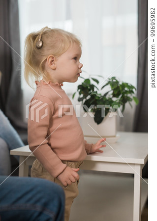 Cochlear implant system. Installation cochlear implant on child girl ear for restores hearing. Kid hears after hear return to normal Cochlear implant system. Installation cochlear implant on child girl ear for restores hearing. Kid hears after hear return to normal 99695982