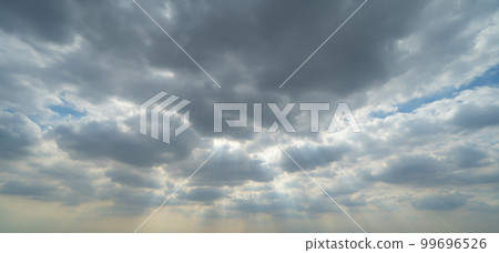 Sunset sky. Abstract nature background. Dramatic blue with orange colorful clouds in twilight time. 99696526