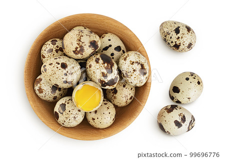 Raw quail egg in wooden bowl isolated on white background with full depth of field. Top view. Flat lay Raw quail egg in wooden bowl isolated on white background with full depth of field. Top view. Flat lay 99696776