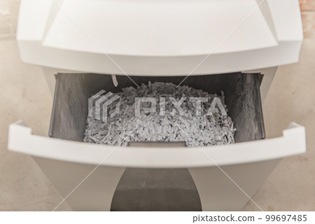 Industrial paper shredder. Paper shredder in the office, use and maintenance of professional office equipment. 99697485