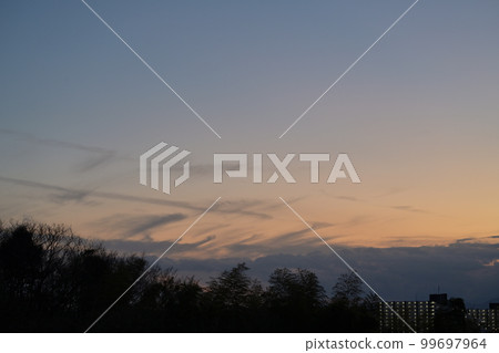 Sunset clouds blown by the wind 99697964