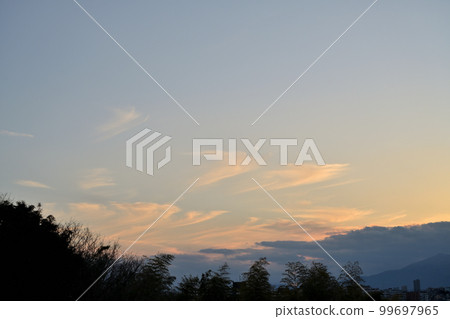 Sunset clouds blown by the wind 99697965