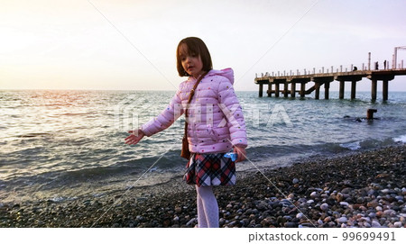 Little girl at the beach Little girl at the beach 99699491