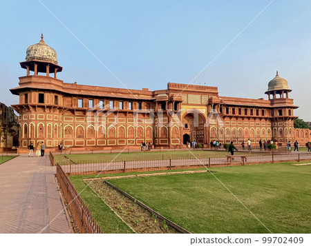 The famous red fort in the city of Agra, India. Tourists visit a popular tourist attraction. The famous red fort in the city of Agra, India. Tourists visit a popular tourist attraction. 99702409